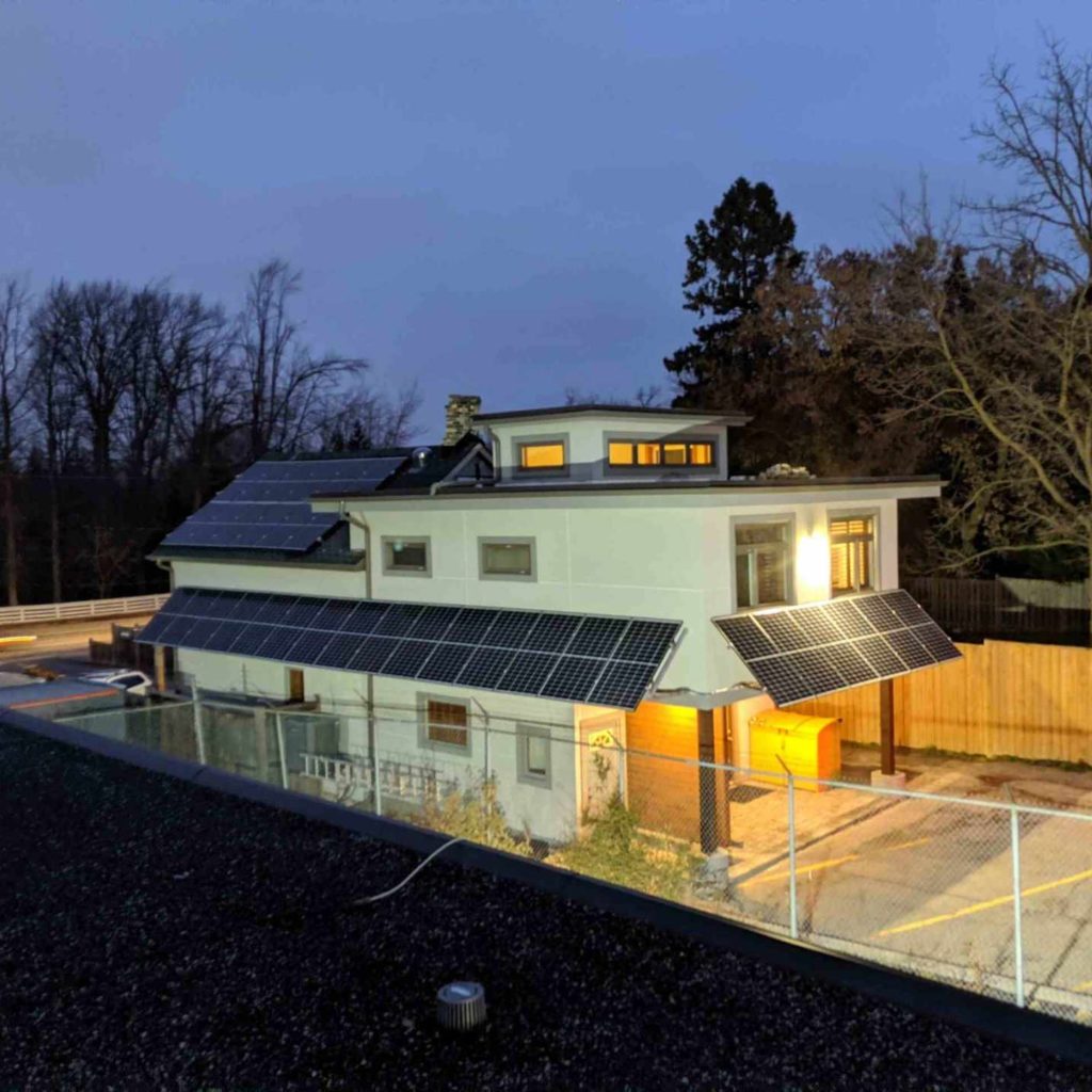 Side birds-eye-view of AET's head office in Kitchener, showcasing the roof-mounted solar array system.