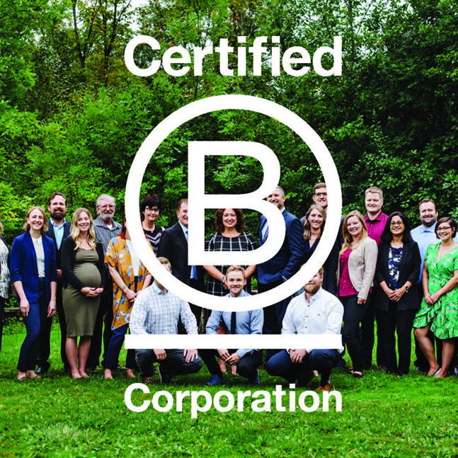 Group photo of smiling employees behind Certified B Corporation logo.