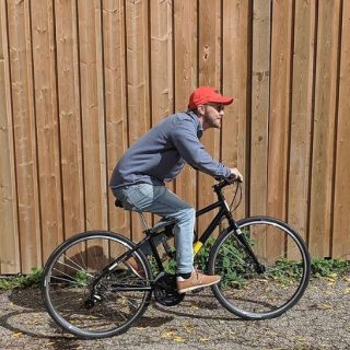 AET employee riding a bike.